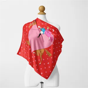 Detail of red square silk scarf with heart patterns and fairy tale print on mannequin