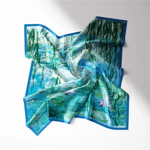 Detail of Monet-style water lily silk scarf with vibrant blue and green oil painting patterns