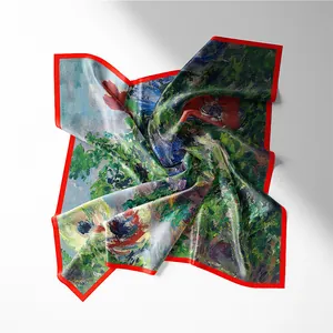Close-up of impressionist floral silk scarf with vibrant red borders and artistic pattern