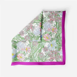 Detail of French floral and bird print on high-quality silk square scarf with rolled edges