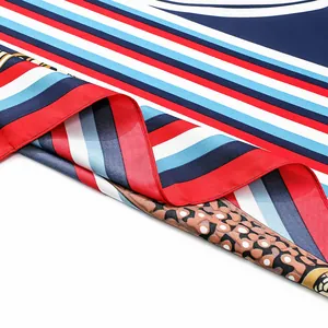 Detailed view of 130cm silk scarf showing vintage geometric patterns and smooth texture