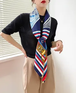 Detail of elegant geometric horse pattern silk scarf styled with chic office attire
