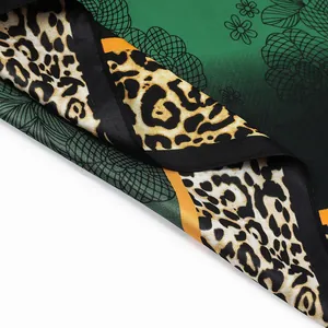 Green leopard print silk scarf for women featuring floral patterns and smooth satin finish