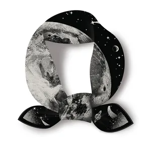Silk square scarf with black and white celestial moon and stars pattern in a circular knot