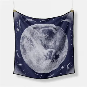Detail of silk scarf showing vintage moon and unicorn print on Prussian blue background
