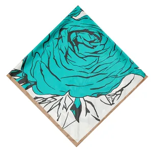 Detail of teal hand-painted rose pattern on a 130cm white satin square silk scarf