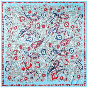 Blue paisley square scarf with red heart patterns in a premium silk-like flat lay view