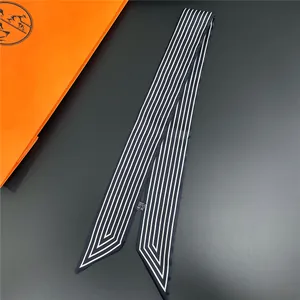 French style striped silk ribbon scarf for handbags and hair with orange gift bag background