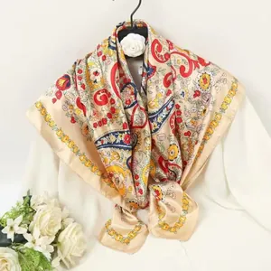 Close-up of bohemian silk scarf with paisley patterns hanging on a black hanger