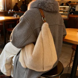 Chic beige faux fur tote bag with brown leather straps shown in a cozy cafe setting