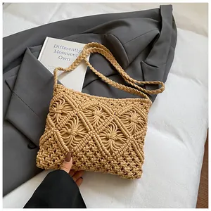 Detail of the intricate diamond weave pattern on this khaki handmade knit crossbody bag