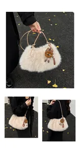 Detail of plush faux fur shoulder bag with leather straps and a cute teddy charm