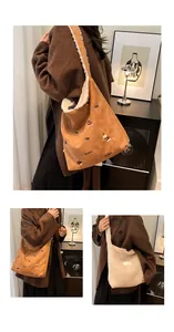 Detail view of suede tote bag with puppy embroidery and plush faux fur lining