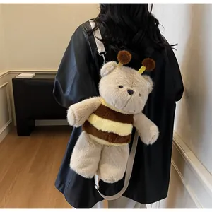 Detail of cute bee-themed plush bear backpack with striped fuzzy texture and straps