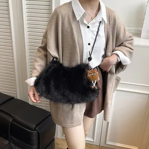 Plush black shoulder bag with cute brown cat pendant, winter faux fur hobo tote for women