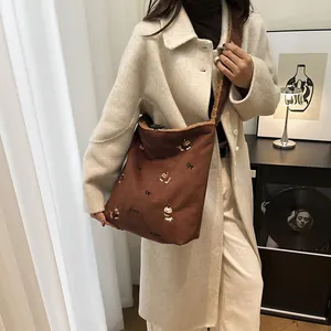 Brown suede tote bag with puppy embroidery and plush fleece trim for casual daily use