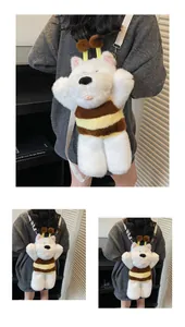 Detail of cute white bear plush bag in bee costume with soft adjustable straps