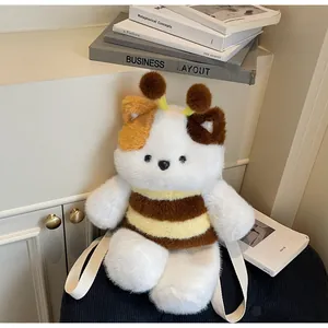 Detail of soft calico cat plush backpack with honeybee antennae and white straps