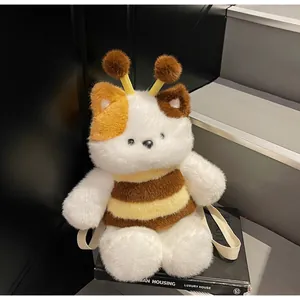 Detailed plush bee-cat crossbody bag shown on books with soft textured faux fur detail