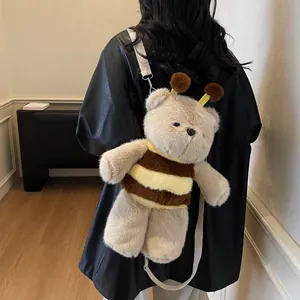 Cute teddy bear plush backpack with bee stripes and soft straps shown on model