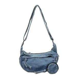 Retro washed denim crossbody bag in blue with adjustable strap and coin purse charm