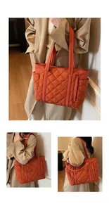 Close-up of orange quilted tote bag featuring side pockets and spacious interior detail
