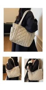 Detail of large beige quilted tote bag showing diamond stitching and side pocket