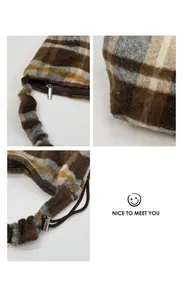 Detail view of silver zipper and plaid textured fabric on vintage shoulder bag