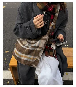 Classic plaid tote bag styled with a wool coat and scarf for a cozy winter commute look