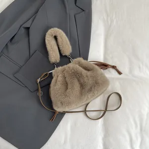 Detailed flat lay of a plush coffee cloud bag with faux fur texture and leather strap