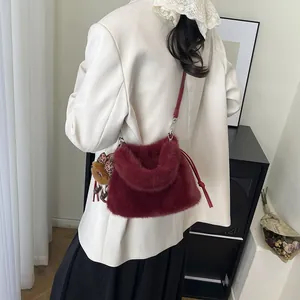 Burgundy faux fur crossbody bag with cute teddy bear charm and leopard bow