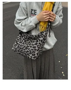 Fashionable leopard print faux fur shoulder bag worn with casual autumn streetwear outfit