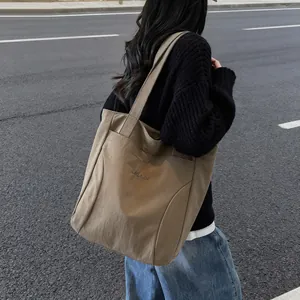 Minimalist khaki large-capacity canvas tote bag with elegant letter embroidery