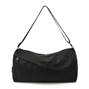 Sac bandoulière noir en tissu Oxford de grande capacité au design cylindre étanche