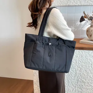 Large black puffer tote bag with drawstring pocket for casual women's daily commute