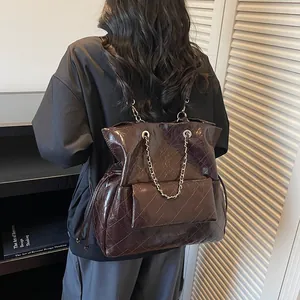 Retro large capacity dark brown quilted leather backpack with metal chain straps for women