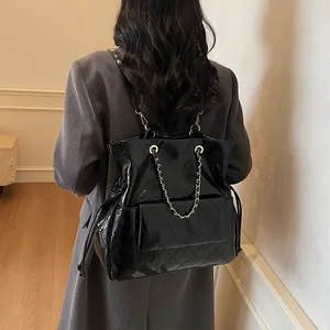 Quilted black glossy backpack for women featuring stylish silver chain and large capacity