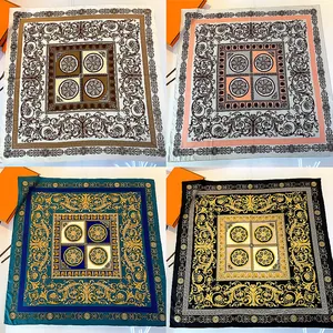 Detail of four silk scarves with baroque floral patterns and Greek meander borders