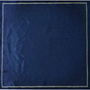 Navy blue silk scarf with white polka dots and gold border flat lay display