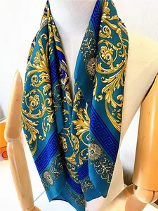 Detail of silk twill scarf with baroque floral patterns and Greek fret design on a mannequin