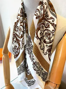 Detail of hand-rolled edges and baroque floral patterns on a 90cm silk-like scarf