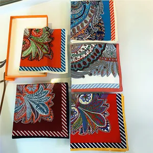 Silk square scarf detail featuring paisley patterns with classic orange gift box set