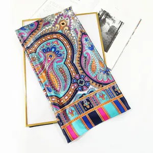 90cm Bohemian paisley silk scarf with vibrant floral patterns draped on a gold frame