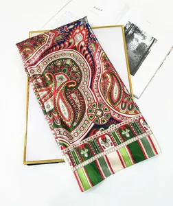 Detail of silk-texture bohemian paisley floral scarf with vibrant ethnic print patterns