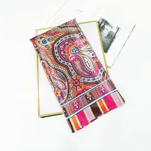 Detail of 90cm bohemian paisley silk scarf featuring vibrant colors and striped borders