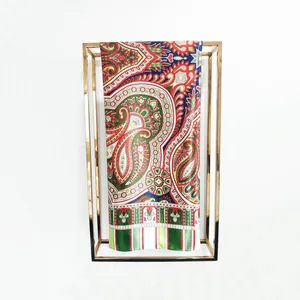 Detail view of 90cm Bohemian paisley silk scarf with vibrant floral patterns and striped edge