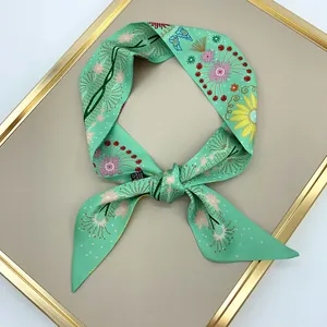 Daisy double layer mint green floral ribbon scarf tied on a luxury display board