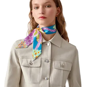 Silk giraffe pattern narrow scarf twilly tied around neck with beige denim jacket