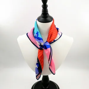 53cm colorful abstract print silk scarf with satin finish on a white mannequin