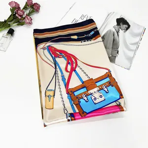Classic silk scarf featuring vintage handbag and chain prints on white background